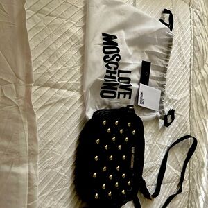 Black with gold studded hearts. Barely used and like new